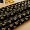Camelot® Fabrics Harry Potter™ Metallic Gold Deathly Hallows™ Cotton Fabric